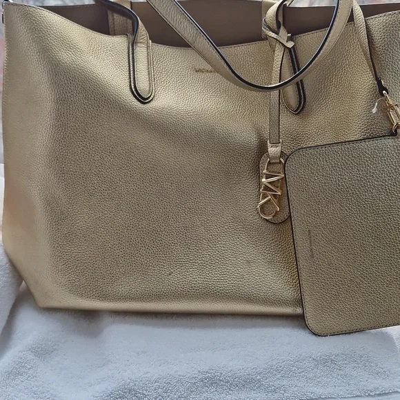 Michael Kors Shimmering  Gold Riversible Tote. - Picture 11 of 14